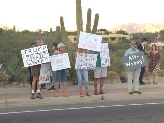 Protesters gathered outside the J.W. Marriott Starr