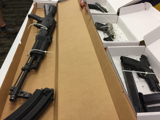This rifle and clip, along with handguns, were seized