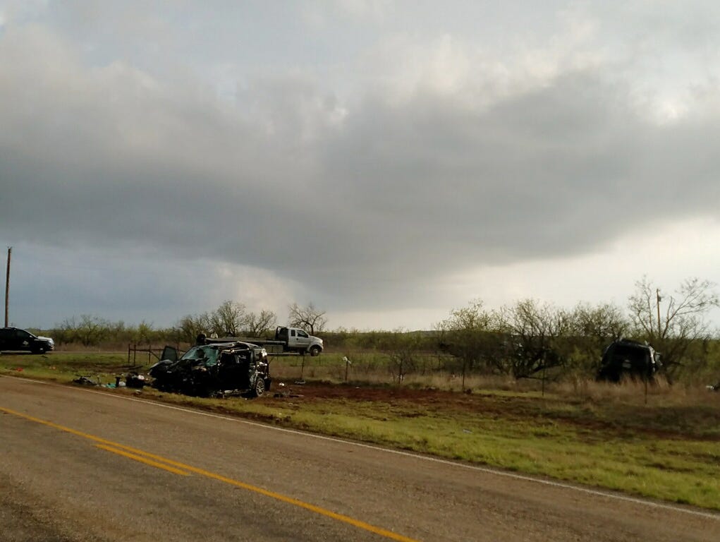 Texas Department of Public Safety troopers investigate a two-vehicle crash that left several storm chasers dead Tuesday , March 28, 2017, near Spur, Texas. Tornadoes had been reported nearby at the time of the crash and heavy rain had been reported i