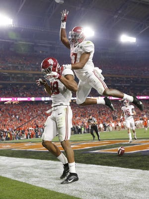O.J. Howard (88) and Kenyan Drake (17) of Alabama celebrate a touchdown during the fourth quarter of the College Football Championship game at the University of Phoenix Stadium in Glendale, Az., on Monday, January 11, 2016.