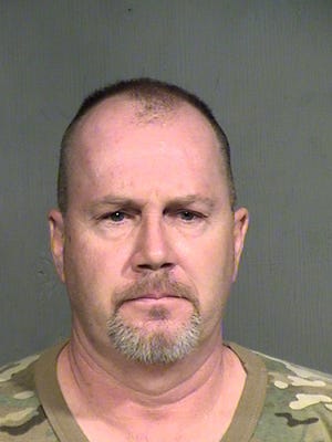 This booking photo provided by the Maricopa County Sheriff shows suspect Richard Malley, 49, who was being held Monday Aug. 19, 2013, on $10,000 bond on suspicion of aggravated assault.