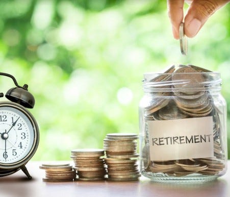 Clock, coins, and retirement savings jar full of money