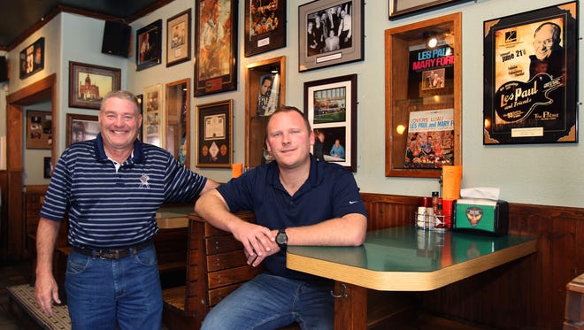 Dan  "Poky" Pokwinski (left), is the former owner of Club 400 and put up photos to recognize the bar's connection to guitar legend Les Paul. He's been mentoring new owner Jimmy Lindenberg.