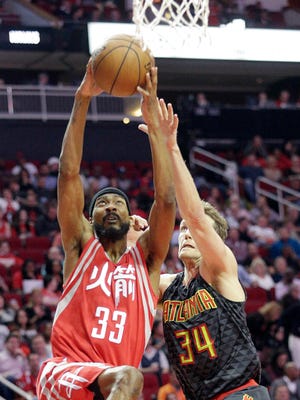 Houston Rockets forward Corey Brewer (33) drives against Atlanta Hawks guard Mike Dunleavy (34) on Feb. 2, 2017.
