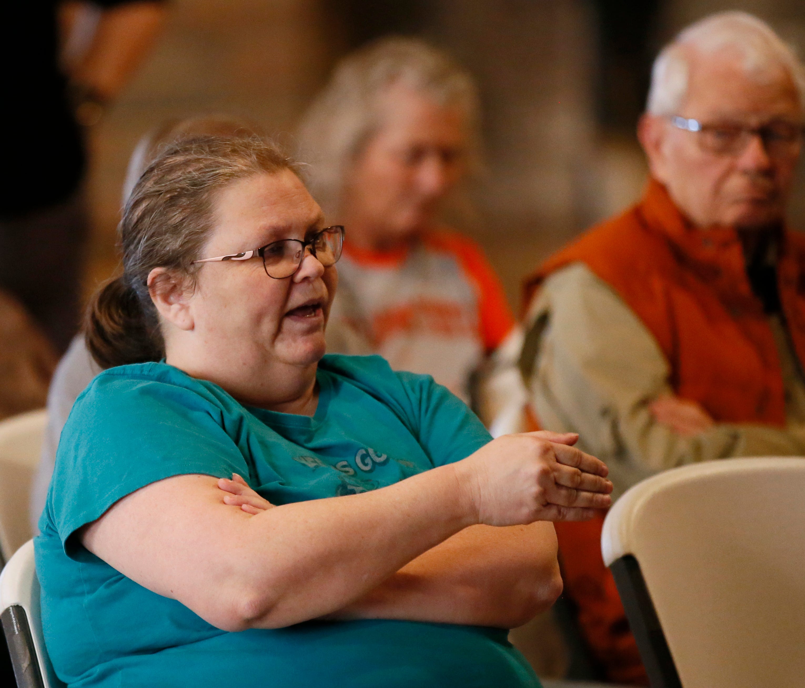 Pattye McAbee, of Carney, Okla., asks a question of U.S. Rep. Frank Lucas, R-Oklahoma, during a town hall meeting in Chandler, Okla., Wednesday, Feb. 22, 2017. McAbee said that she had voted for Hillary Clinton and wanted Congress to leave Obamacare 