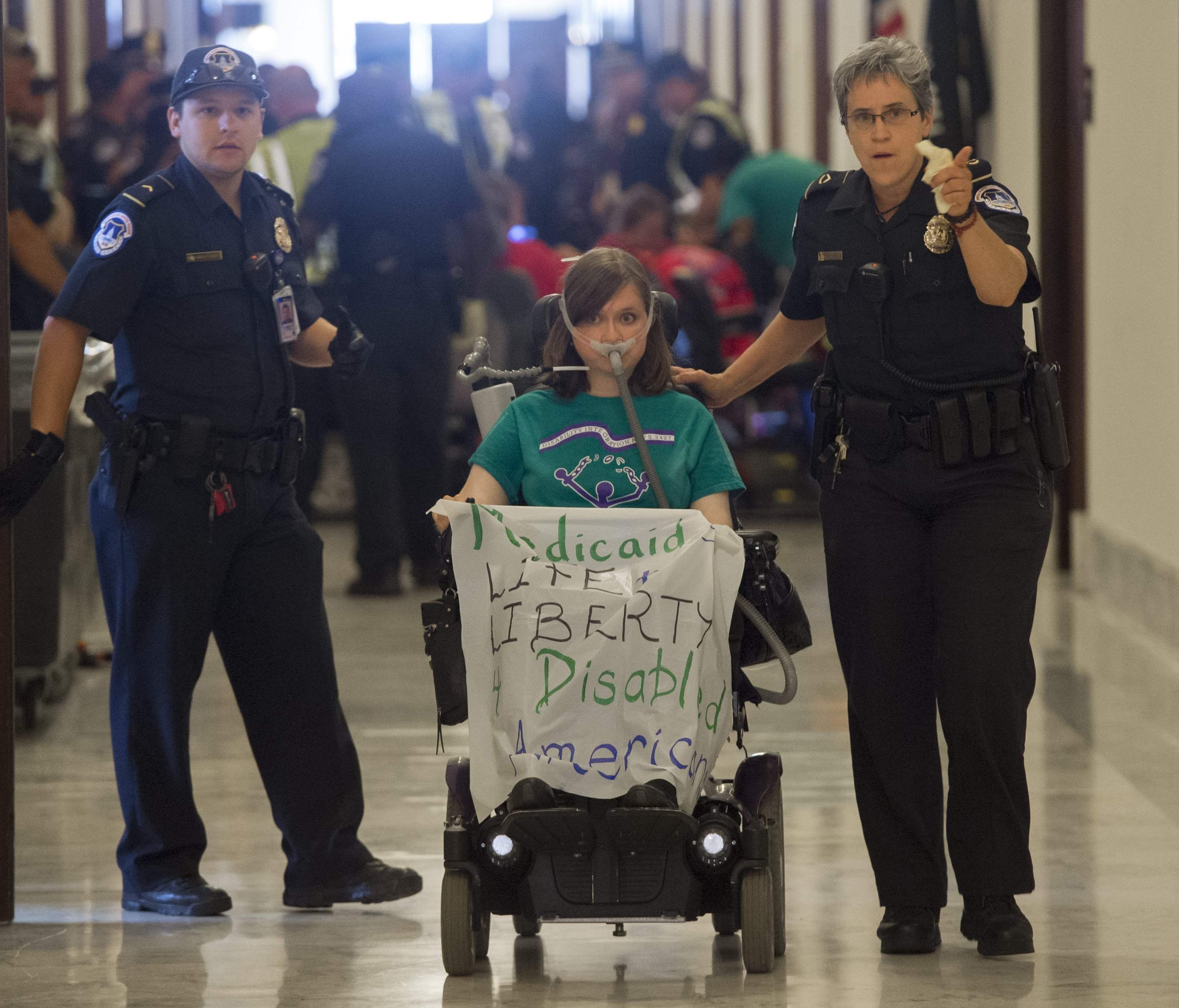 U.S. Capitol Police arrest a health care protester outside the office of Senate Majority Leader Mitch McConnell on June 22, 2017.