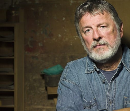 Older man with serious expression