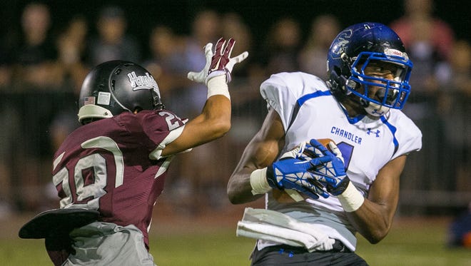 Chandler High wide receiver N'Keal Harry (right) catches a pass in the end zone over Chandler Hamilton defender Bryce Williams during their high school football game on Oct. 2, 2014.