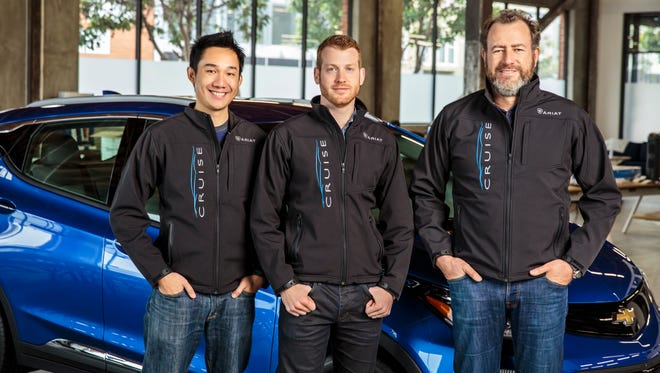 General Motors President Dan Ammann (right) with Cruise Automation co-founders Kyle Vogt (center) and Daniel Kan (left).