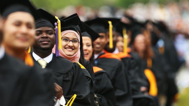 Graduating students participate in commencement exercises at City College  on June 3, 2016 in New York City.