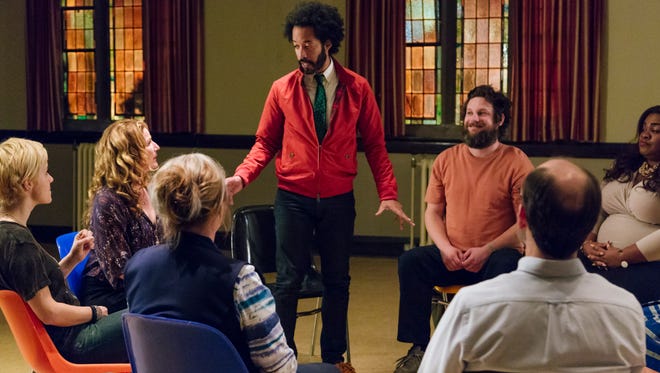 Skeptical journalist Ozzie Graham (Wyatt Cenac) infiltrates a small-town alien-abduction support group in offbeat comedy 'People of Earth.'