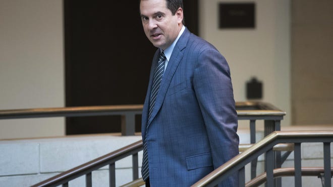 In this Feb. 27, 2018 file photo, House Intelligence Committee Chairman Devin Nunes, R-Calif., a close ally of President Donald Trump, arrives at the Capitol in Washington. Nunes is suing Twitter and several of its users for more than $250 million, accusing them of defamation and negligence. The suit filed Monday, March 18, 2019, in Virginia accuses Twitter of "knowingly hosting and monetizing content that is clearly abusive, hateful and defamatory."