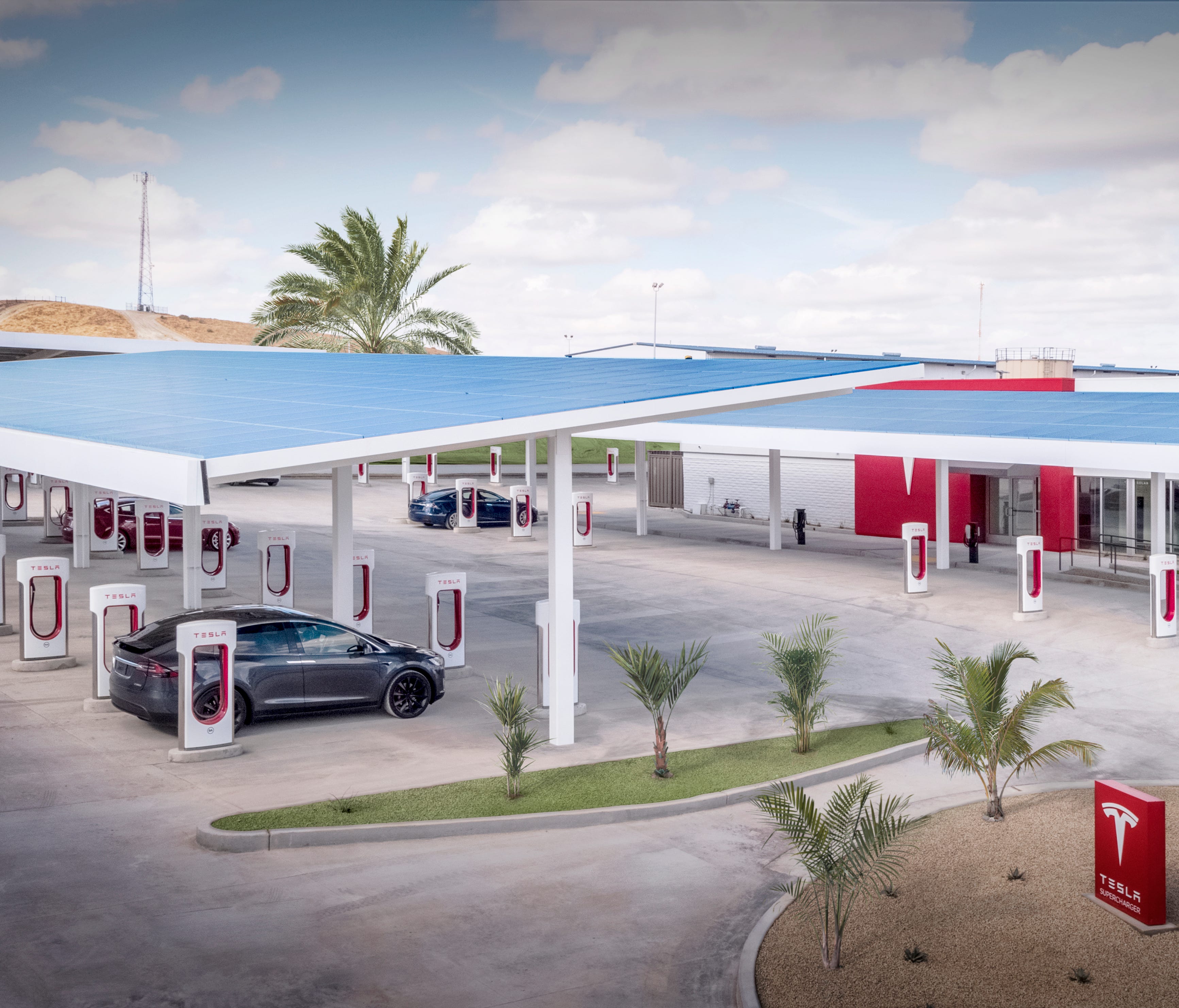 Tesla's Supercharger station in Kettleman City, Calif., is one of the company's largest. A new Supercharger station planned for Santa Monica will include a drive-in restaurant.