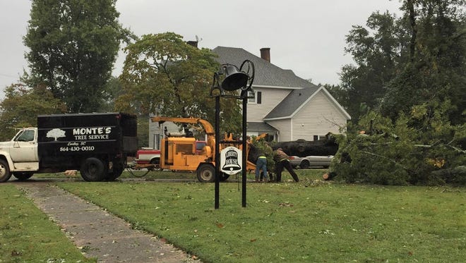 Pickens County News reader Chris Carroll submitted several pictures of day-after storm damage around Liberty, including this shot of workers busy outside the Liberty House Bed and Breakfast.