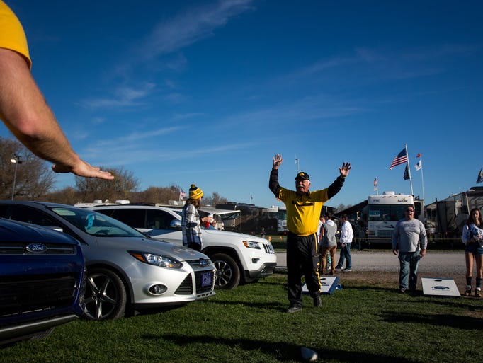 Ken Sickels of Iowa City, Ia., plays cornhole while