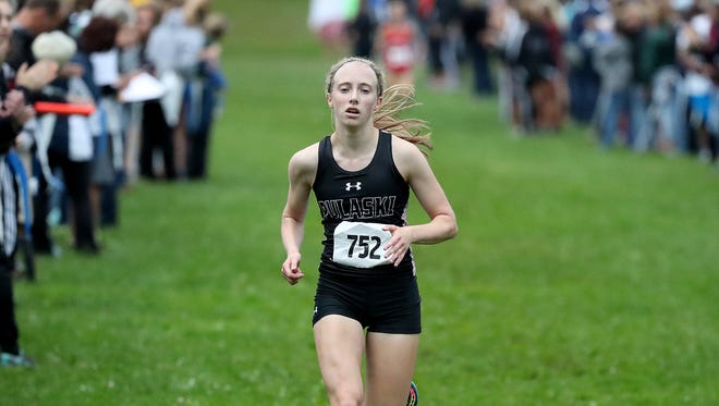 Annika Linzmeier of Pulaski takes first place Thursday, September 7, 2017 during the Southwest Invitational cross country meet in Colburn Park in Green Bay, Wis.