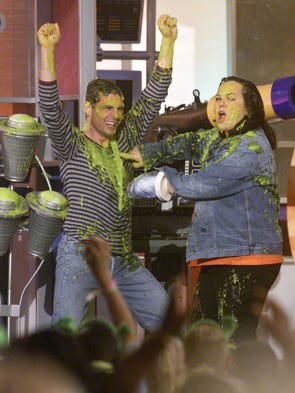 Tom Cruise and Rosie O'Donnell react after being slimed