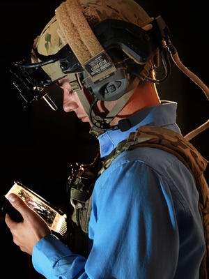 
Systems engineer Chris Nord is outfitted in a wearable situational awareness ensemble at Raytheon in Dayton, Ohio, on Oct. 9. 
