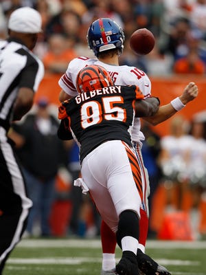 Bengals defensive end Wallace Gilberry strips Giants quarterback Eli Manning, causing a fumble during their 2012 game that Cincinnati won 31-13.