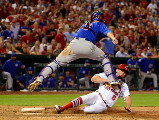 Bourjos scores on throwing error in 10th as Cards beat Cubs