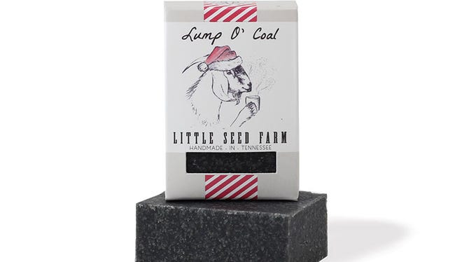 The tiny Lump O' Coal activated charcoal soap is a popular holiday item for Little Seed Farm.