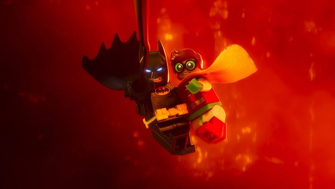 Batman (voiced by Will Arnett) saves Robin from certain doom in 'The Lego Batman Movie.'