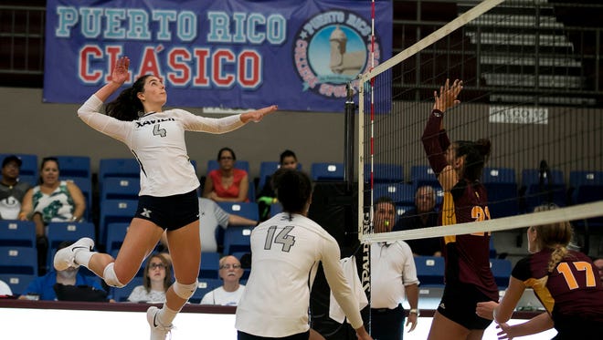 Xavier University senior Laura Grossman (4), from 
Humacao, Puerto Rico, traveled with her Xavier volleyball teammates to the Puerto Rico Classic in early September so Grossman could play in front of her family and friends just one year removed from the devastation left by Hurricane Maria.