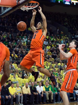 Oregon State guard  Malcolm Duvivier with a put-back dunk early in the first half in Saturday's 91-81 loss at No. 16 Oregon.