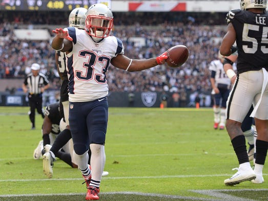New England Patriots running back Dion Lewis celebrates