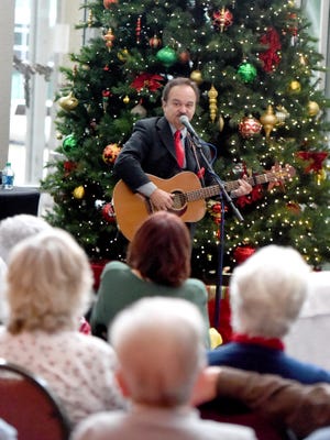 Recording artist Jimmy Fortune performs to those gathered in the atrium at Augusta Health on Monday, Dec. 14, 2015. The concert marked Fortune's 11th holiday concert at the hospital. 