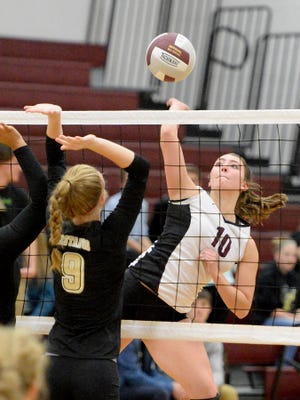 Stuarts Draft's Maddy Riley spikes the ball as Monticello's Michaela Tolley goes for the block during their Conference 29 first-round match Mnday in Stuarts Draft.