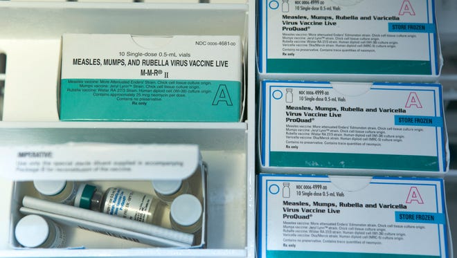 Boxes of the measles, mumps and rubella virus vaccine (MMR) and measles, mumps, rubella and varicella vaccine are shown inside a freezer at a doctor's office in Northridge, Calif., in this Jan. 29 file photo.