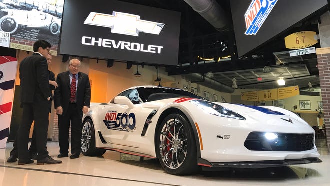 From left, Indianapolis Motor Speedway President Doug Boles, Indianapolis Mayor Joe Hogsett and Chevy Racing Marketing Manager Jeff Chew look over the newly announced pace car for the 101st Indianapolis 500, a Chevrolet Corvette Grand Sport, at Bankers Life Fieldhouse Friday, May 5.