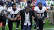 Ray Lewis kneels with Ravens players during the anthem