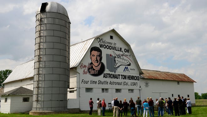 A newly painted barn in Woodville honors hometown hero Col. Tom Henricks, a NASA astronaut who flew on four space shuttle missions.
