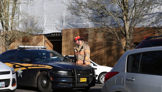 Salem Fire respond to the Oregon Supreme Court building after smoke was detected in an elevator shaft Tuesday, Feb. 9, 2016, in Salem, Ore. The building was evacuated while firefighters investigated. 