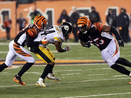 Jan 9, 2016; Cincinnati, OH, USA; Cincinnati Bengals outside linebacker Vontaze Burfict (55) hits Pittsburgh Steelers wide receiver Antonio Brown (84) during the fourth quarter in the AFC Wild Card playoff football game at Paul Brown Stadium. Burfict was called for a personal foul on the play. Mandatory Credit: Aaron Doster-USA TODAY Sports