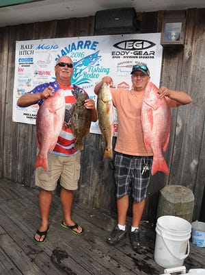 Local anglers Jim Olson and Brandon Semsick weighing their catch at last years Navarre Fishing Rodeo.