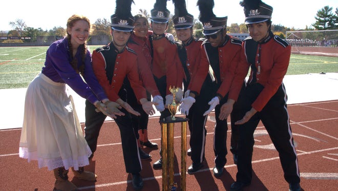 Members of the Glen Ridge High School Marching Band pose with their trophy following the USBands National Competition in Allentown, Pa. on Nov. 5.