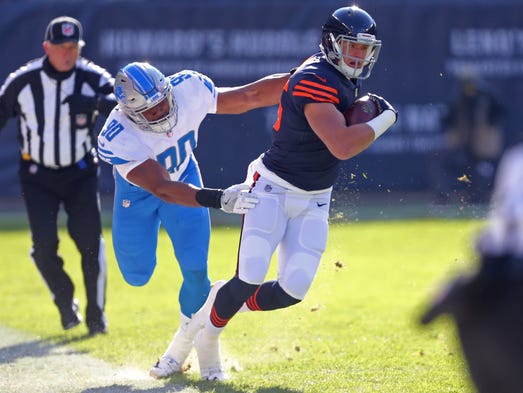Chicago Bears tight end Daniel Brown is tackled by