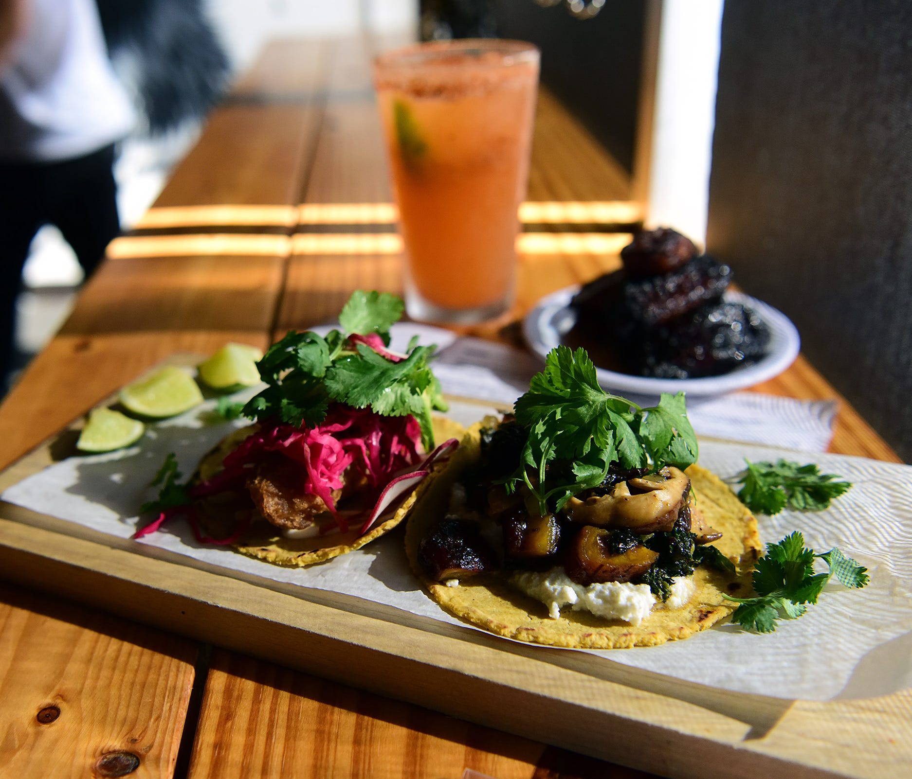 At Black Rooster Taqueria, a variety of tacos, such as the Black Rooster asada (right) and the vegetarian, range from $3.25 to $4.75.