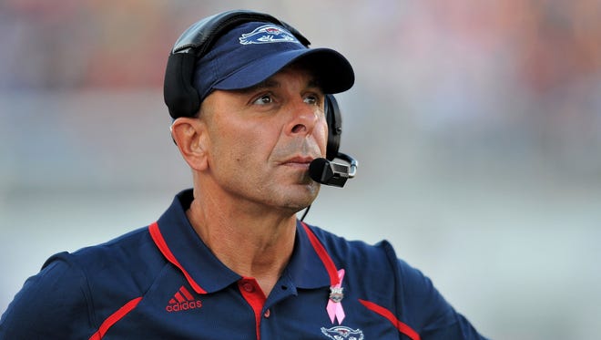 Florida Atlantic football coach Carl Pelini resigned Wednesday after an incident of "illegal drug use".