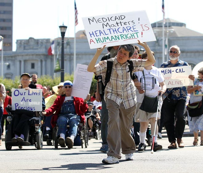Disabled people protest cuts to Medicaid in San Francisco.