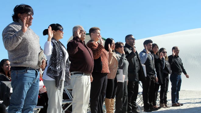 Fourteen candidates from Mexico and Germany were sworn in as American citizens on Thursday in White Sands National Monument.