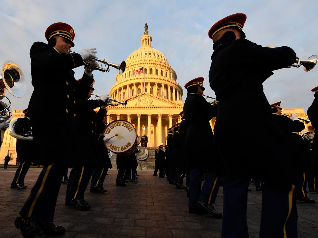 The United States Army Band marches past the East Front of the Capitol during a rehearsal for the presidential inauguration.