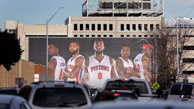  A billboard of the Detroit Pistons near the site of the future Little Caesars Arena in Detroit on November 22, 2016.