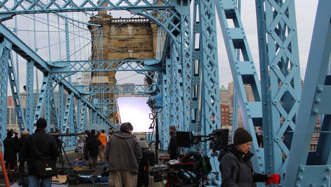 Crews prepare to shoot a Cincinnati Bell commercial on Thursday on the Roebling Bridge. The commercial will air during the Super Bowl.