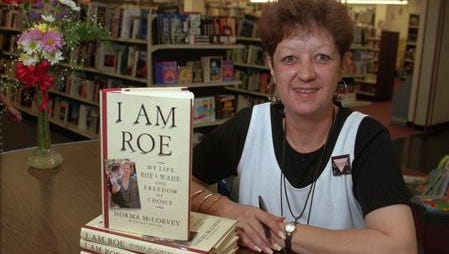 Norma McCorvey, who was "Jane Roe," poses with her book at an Addison, Texas, bookstore June 23, 1994. McCorvey died at age 69, two decades after the landmark 1973 Supreme Court Roe v. Wavde ruling that legalized abortion