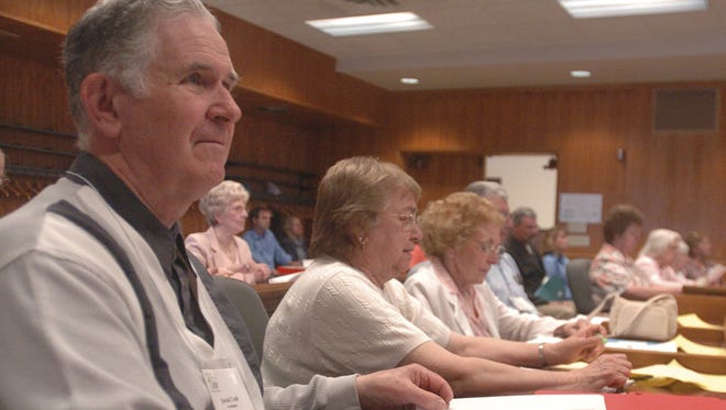 David Crail listens to a county board meeting at the Wood County Courthouse 2005, as a participant in the Senior Statesmanship Program. Crail, a retired pastor at Wesleyan Church in Wisconsin Rapids, died Friday.