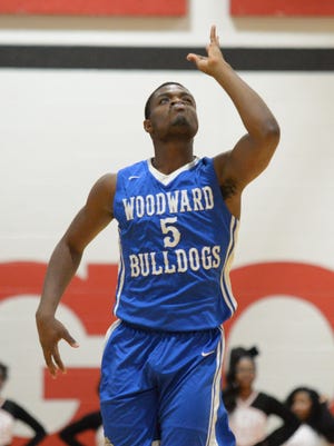Woodward forward Terry Durham celebrates after making a 3 pointer against Hughes, Hughes High School, Friday, January, 19, 2018